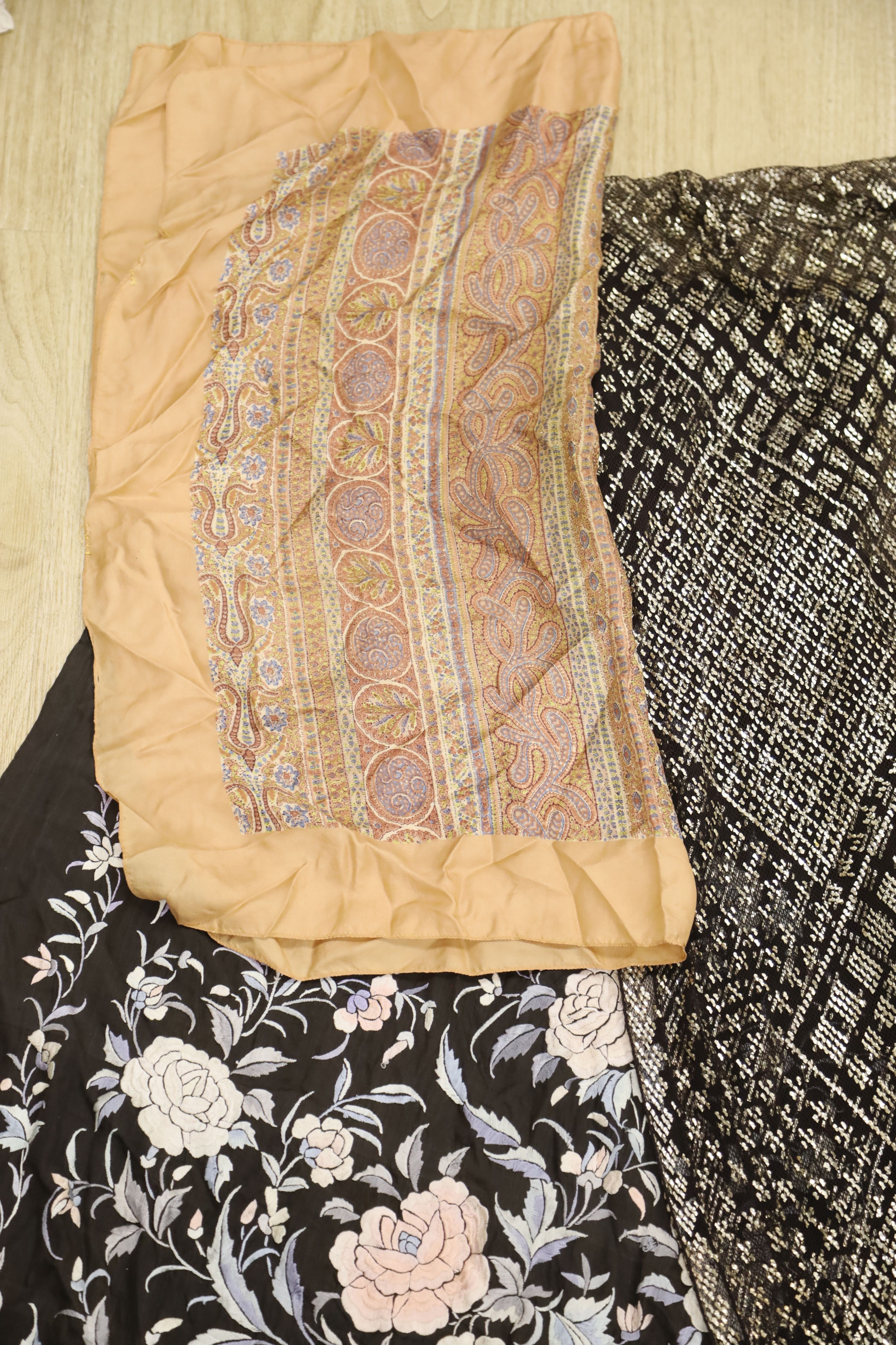 An Egyptian 1920s metal on net stole and a blue, pink and cream Chinese embroidered stole on black silk background